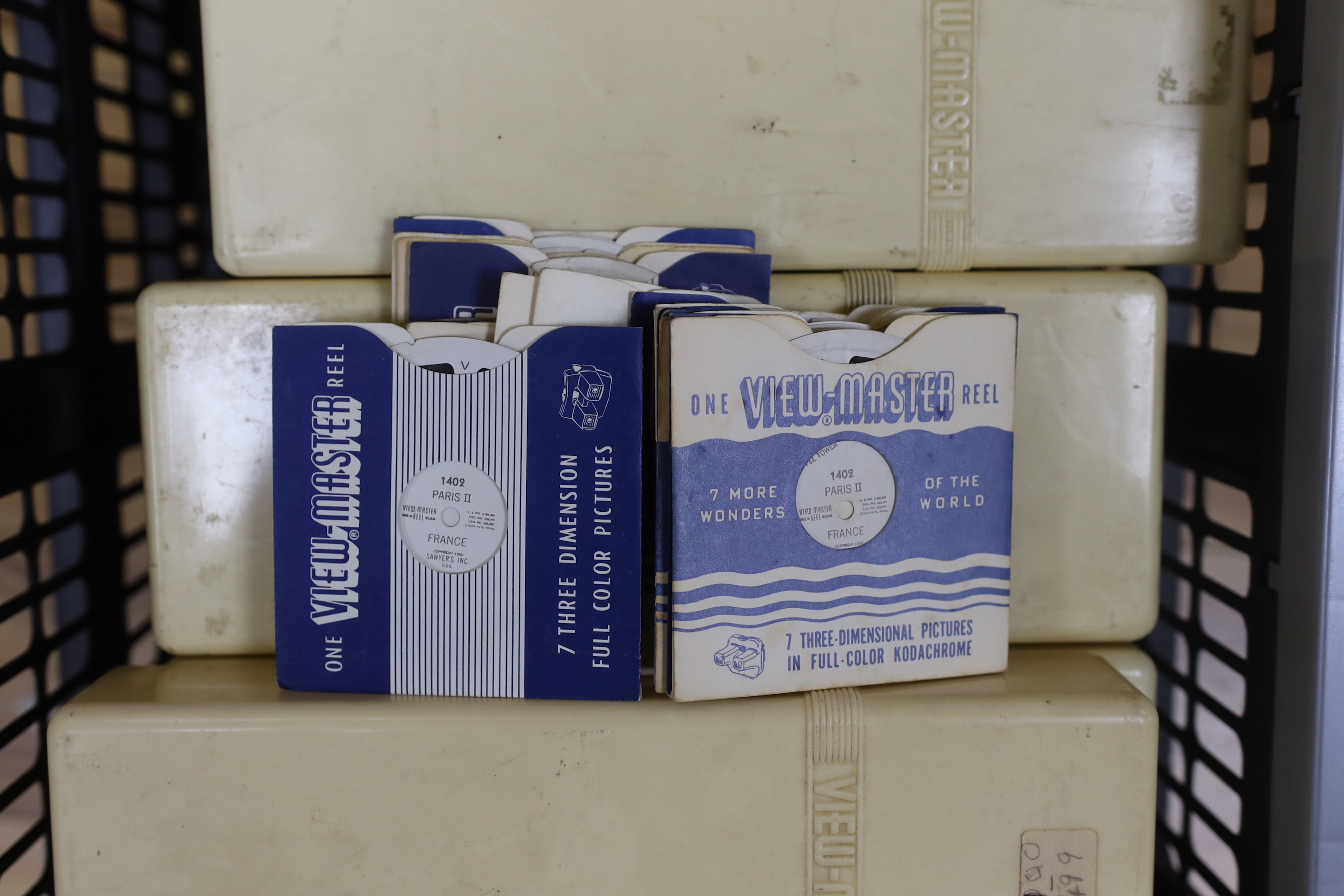 Three View-Master projectors and four View-Master viewers, together with eight View-Master plastic boxes containing a large quantity of reels with subjects including views of the United States, National Parks, Italy, Ger